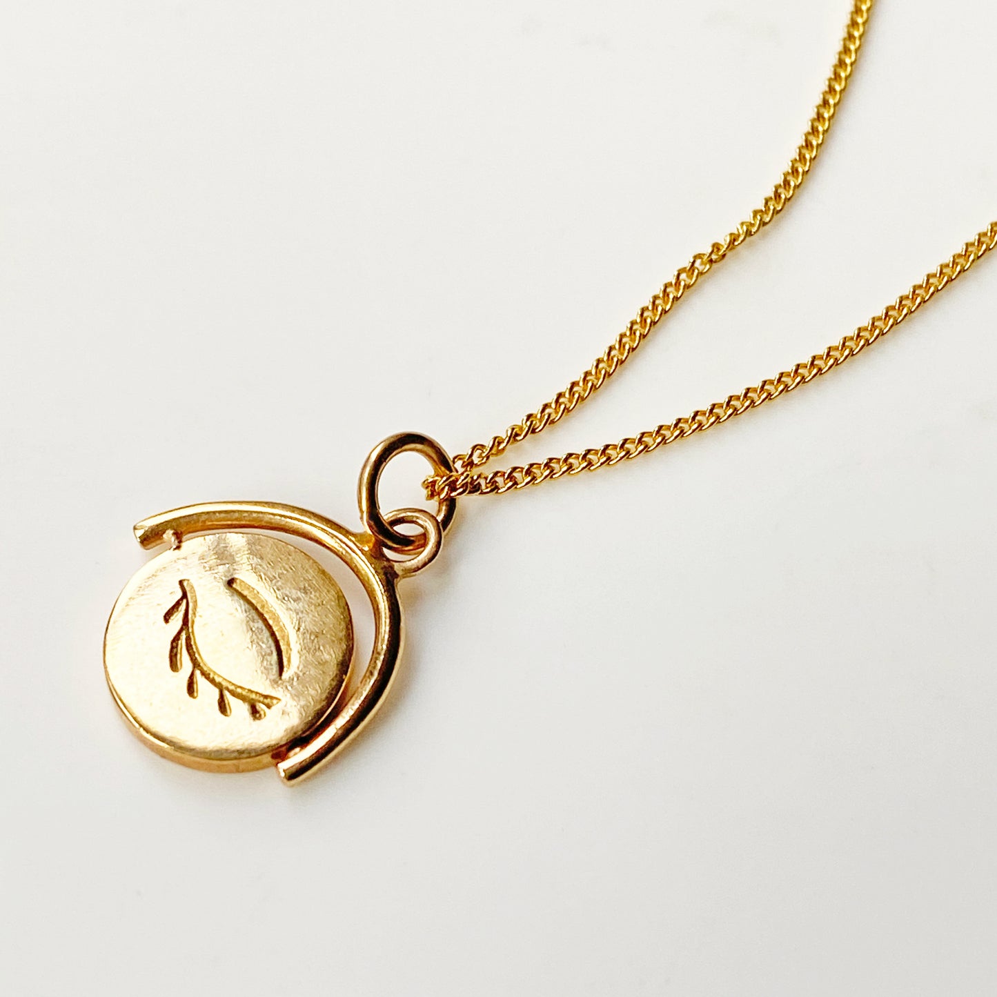 Winking Eye Spinning Pendant in Gold