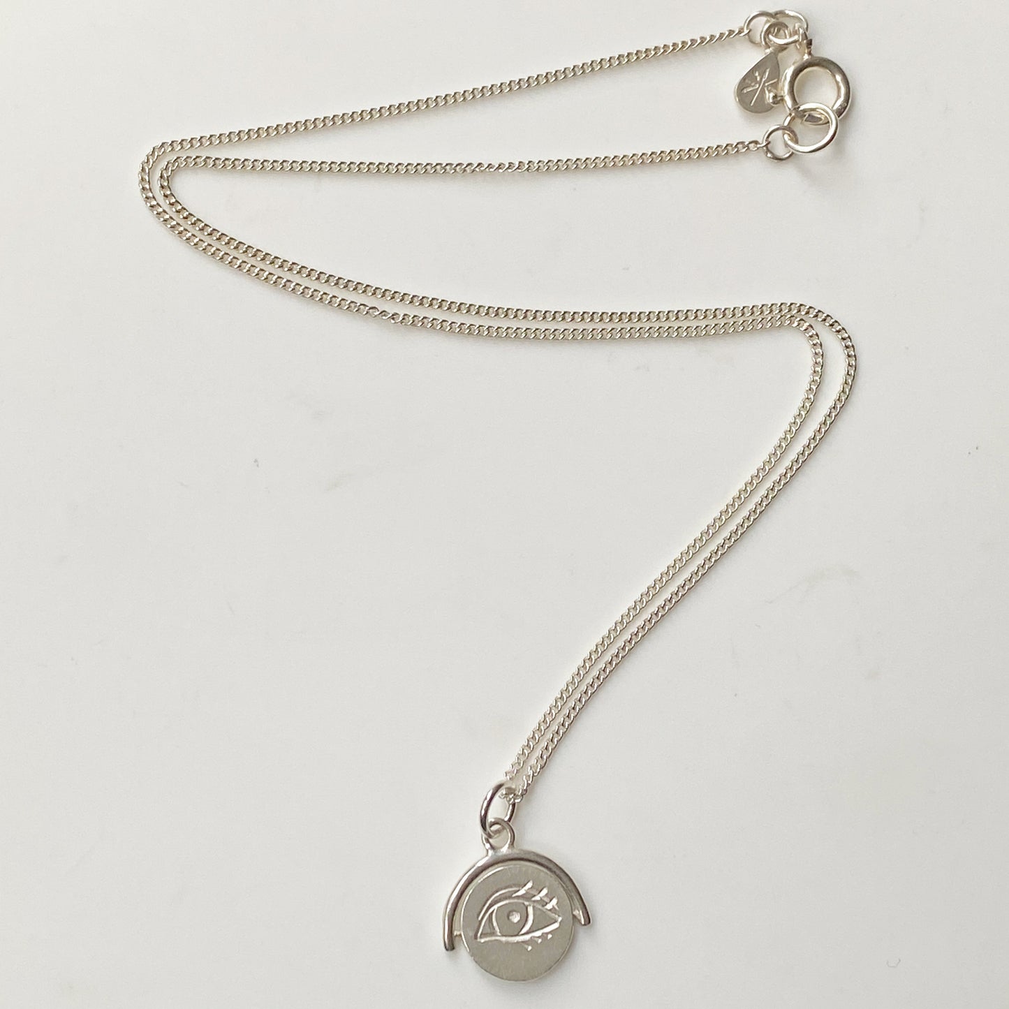 Winking Eye Spinning Pendant in Silver